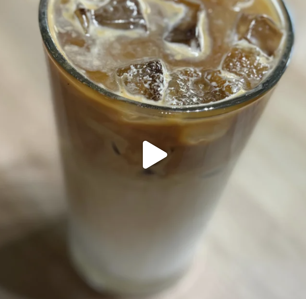 Iced latte in a tall glass.