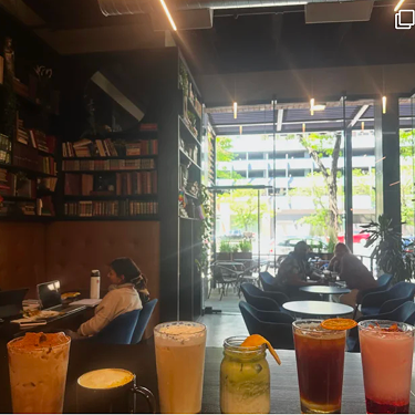 Cupla Coffee interior with iced drinks on a table.