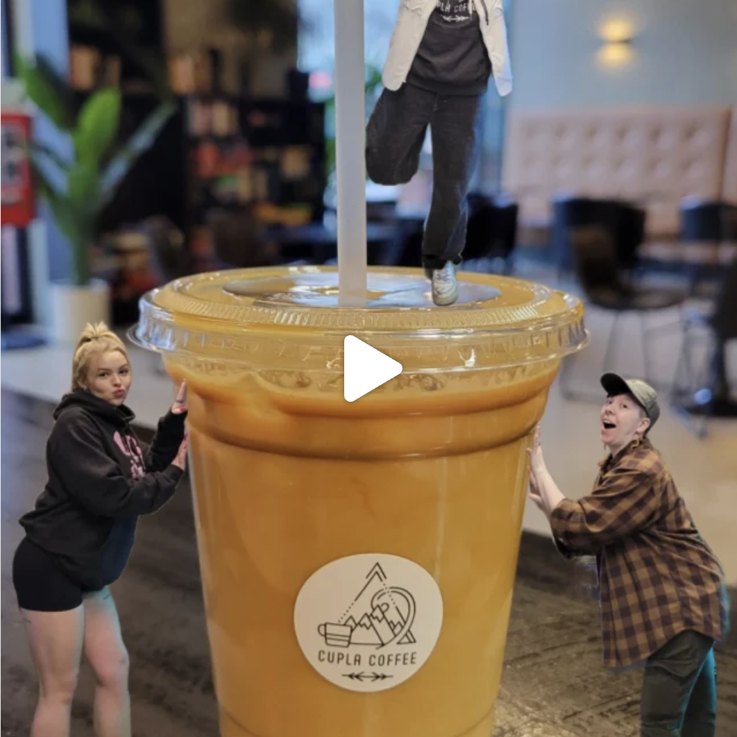 Giant Cupla Coffee cup with two friends posing.